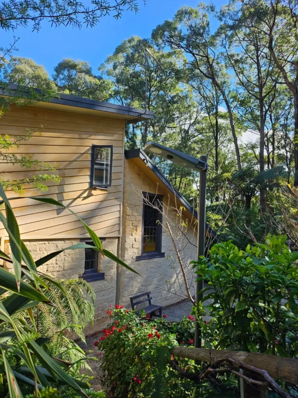 Cozy cottage surrounded by lush greenery